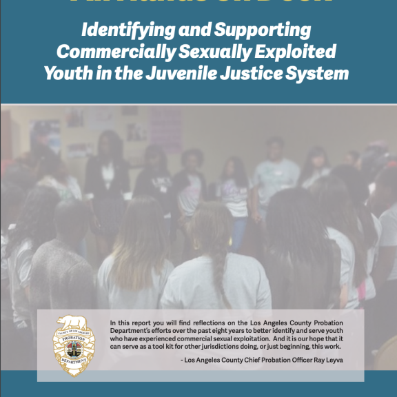 Report cover includes title and blurred picture of youth behind formed in a circle