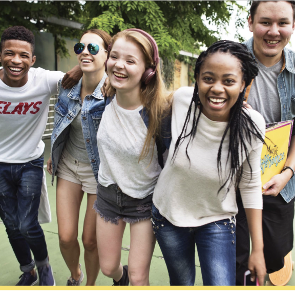 Report cover with title and photo of group of smiling teens outside