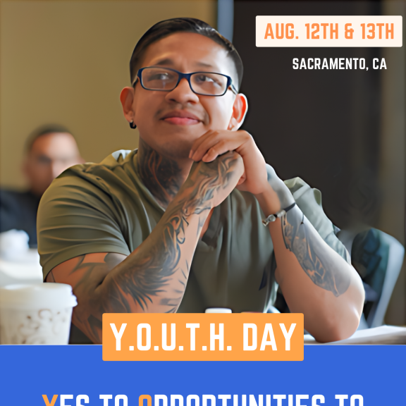 Young person sitting at a desk. "Yes to Opportunities to Uplift, Thrive, and Heal"