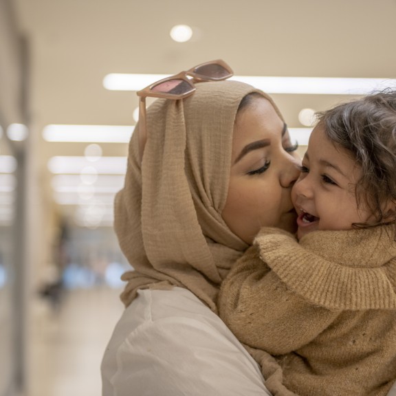 Mother hugging her child