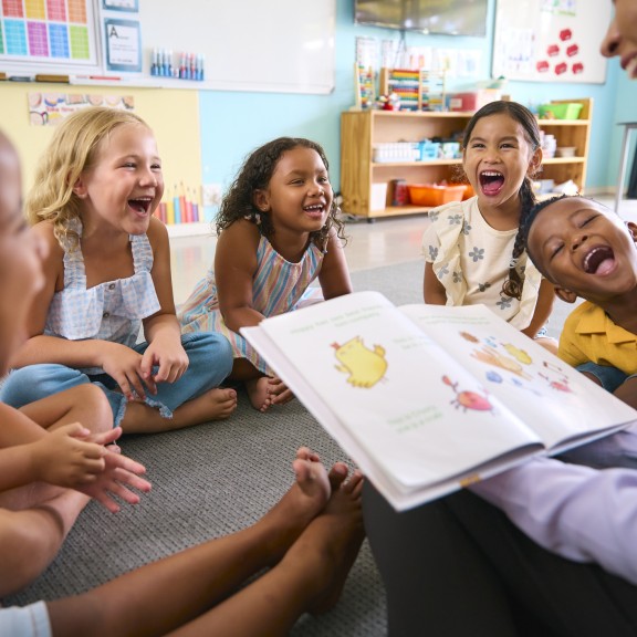 Young children enjoying storytime at school