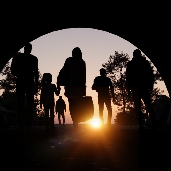 Immigrant family walking through tunnel