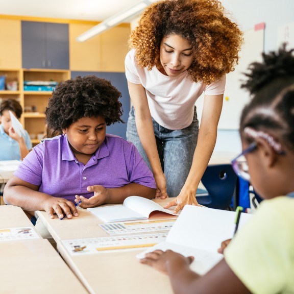 Teacher supports students in class