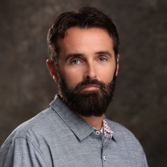 Portrait photograph of Shane Carr