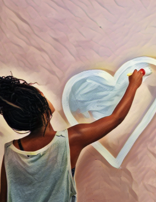 Picture of young person from behind painting a heart on a wall