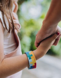 Child and parent holding hands