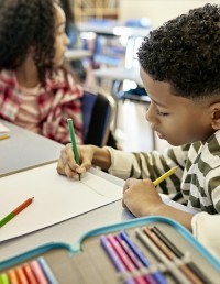 Student writing in class