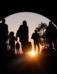 Immigrant family walking through tunnel